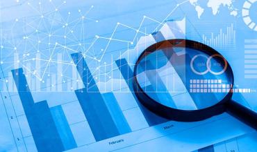 Federal Judge Orders HUD to Implement Small Area FMRs a magnifying glass looking at bar graphs