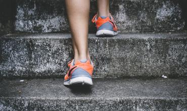 an athlete running up stairs