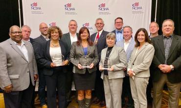 NCHFA staff holding their trophies