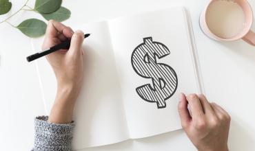 A money sign drawn on a piece of paper