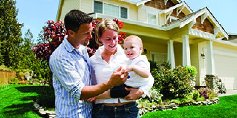 Family in front of house