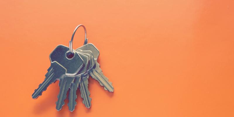 House keys on an orange background