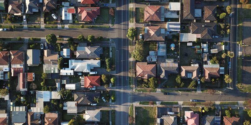 an aerial view of a neighborhood and street