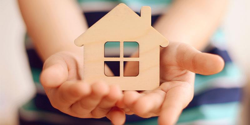NC Housing Finance Agency Awards $8 Million for Home Rehab in 28 Counties Hands holding a wooden house