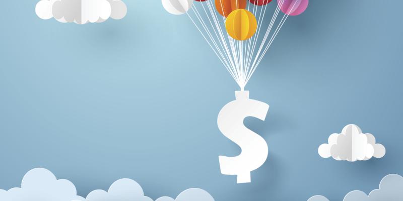 A dollar sign floating with multicolored balloons