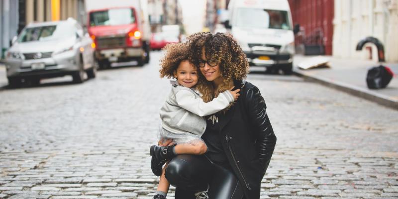 A woman and child hugging