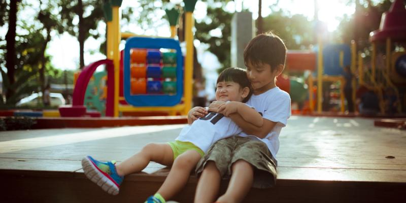 two kids on a playground