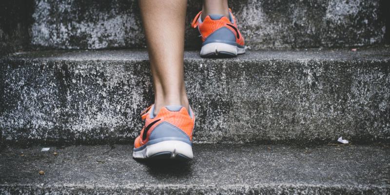 an athlete running up stairs