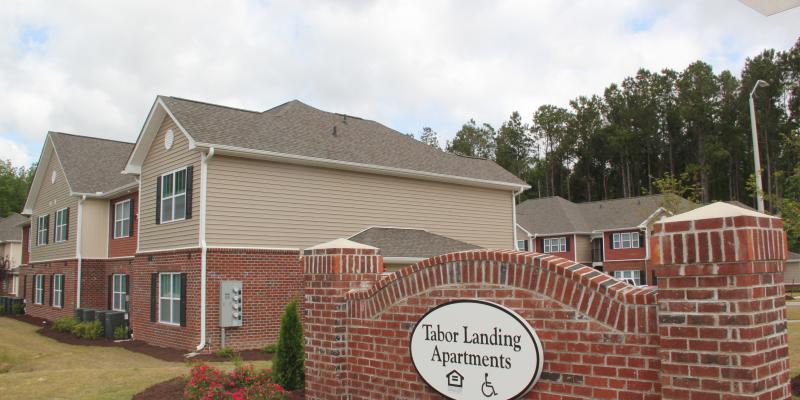 Photo of Tabor Landing sign and building in background